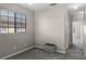 Neutral bedroom featuring modern ceiling fan, large window, and new carpet at 9568 Muse Pl, Orlando, FL 32829