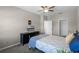 Bedroom boasting modern ceiling fan, large windows, and new carpet at 9568 Muse Pl, Orlando, FL 32829