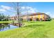 Beautiful landscaping and pond views enhance the backyard at 9568 Muse Pl, Orlando, FL 32829