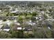 Aerial view of neighborhood with tree-lined streets and houses at 10562 Bridlewood Ave, Orlando, FL 32825