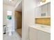 Simple bathroom featuring a tiled walk-in shower, vanity sink, and neutral color scheme at 10562 Bridlewood Ave, Orlando, FL 32825