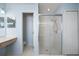 Bathroom with glass shower enclosure and bright lighting at 112 Tate Ct, Orlando, FL 32828