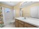 Well-lit bathroom featuring a shower-tub combo and a single-sink vanity at 112 Tate Ct, Orlando, FL 32828