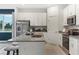 Beautiful kitchen island featuring stainless steel appliances, granite countertop, and eat-in breakfast bar at 1134 Clay Blvd, Tavares, FL 32778