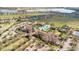 Aerial view of the community clubhouse, swimming pool, and recreational facilities at 117 Cupania Ct, Groveland, FL 34736