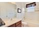 Well-lit bathroom offers ample storage space with a large vanity and built-in shower/tub at 117 Cupania Ct, Groveland, FL 34736