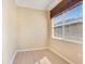 Neutral-toned bedroom with window and light hardwood flooring offers a peaceful retreat at 117 Cupania Ct, Groveland, FL 34736