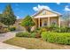 Lovely single-story home with lush front yard landscaping, a brick driveway, and inviting curb appeal at 117 Cupania Ct, Groveland, FL 34736