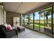 Enclosed screened in patio offers tranquil outdoor living and lake views for enjoying nature's beauty at 11735 Whitewing Ct # 11735, Orlando, FL 32837