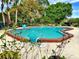 Beautiful swimming pool surrounded by lush landscaping providing a tranquil backyard oasis at 11735 Whitewing Ct # 11735, Orlando, FL 32837