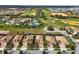 Aerial view showcasing houses with screened-in patios in a beautiful community with lush landscaping at 1304 Sea Pines Way, Davenport, FL 33896