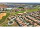 Expansive aerial view of a golf community with well-maintained homes and lush landscaping at 1304 Sea Pines Way, Davenport, FL 33896