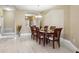 Light and bright dining room with seating for six and views to entryway at 1304 Sea Pines Way, Davenport, FL 33896