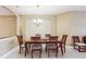 Formal dining room features a chandelier and seating for six at 1304 Sea Pines Way, Davenport, FL 33896