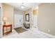 Welcoming foyer with light tile flooring, a decorative table, and a bright entry door at 1304 Sea Pines Way, Davenport, FL 33896