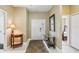 Bright foyer with neutral walls, tile floors, and views into the home's interior at 1304 Sea Pines Way, Davenport, FL 33896