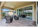 Relaxing covered patio featuring patio furniture and a view of the pool area at 1304 Sea Pines Way, Davenport, FL 33896