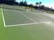 Well-maintained community tennis court with new net and fencing at 1304 Sea Pines Way, Davenport, FL 33896