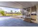 The view of the carport leading to the screened-in porch and landscaped front yard at 134 E Plantation Blvd, Lake Mary, FL 32746