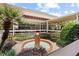 Clubhouse courtyard featuring landscaping, palm trees, and decorative fountain at 134 E Plantation Blvd, Lake Mary, FL 32746