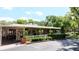 Exterior of clubhouse featuring a white picket fence and lush landscaping at 134 E Plantation Blvd, Lake Mary, FL 32746