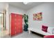 Bright locker room with red lockers, bench, and a potted plant at 134 E Plantation Blvd, Lake Mary, FL 32746