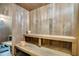 Beautiful wooden sauna with bench seating and a bucket at 134 E Plantation Blvd, Lake Mary, FL 32746