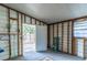 Partially finished room showing the open door to the backyard and a painted blue chair at 134 E Plantation Blvd, Lake Mary, FL 32746