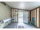 Unfinished room with exposed framing, an open doorway, and a concrete floor at 134 E Plantation Blvd, Lake Mary, FL 32746