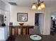 Dining area featuring a classic wooden buffet and chandelier lighting at 1404 High St, Leesburg, FL 34748