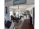 Elegant dining room with dark wood floors and plenty of natural light overlooking the kitchen at 1404 High St, Leesburg, FL 34748