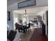 Elegant dining room with dark wood floors and plenty of natural light overlooking the kitchen at 1404 High St, Leesburg, FL 34748