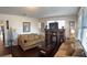 Spacious living room with two sofas, decorative shelving, and a window offering natural light at 1404 High St, Leesburg, FL 34748