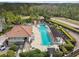 An overhead view of a community pool with a service kitchen and barbecue area at 14530 Damai Ln, Orlando, FL 32821