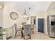 Dining Area featuring a round glass table with 4 chairs and access to the living area at 1531 Norfolk Ave, Winter Park, FL 32789