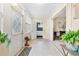 Inviting tiled foyer with natural light, leading to an open floor plan with plant accents at 1531 Norfolk Ave, Winter Park, FL 32789