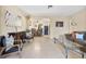 Open living room with tile floors seamlessly connects to the dining area, bathed in natural light at 1531 Norfolk Ave, Winter Park, FL 32789