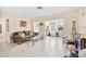 Bright and airy living room features neutral tile flooring and a seamless flow to the foyer at 1531 Norfolk Ave, Winter Park, FL 32789