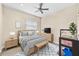 Cozy main bedroom featuring a ceiling fan, stylish furniture, and modern decor at 1531 Norfolk Ave, Winter Park, FL 32789