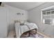 This cozy bedroom features neutral walls, tile floors, and an AC unit at 1627 Triangle Ave, Orlando, FL 32806