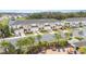 Aerial view of townhomes with pool, playground, and lush landscaping at 2029 Crystal Bell St, Orlando, FL 32824