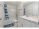 Bathroom featuring a tub with shower, single sink and vanity with white cabinets at 2029 Crystal Bell St, Orlando, FL 32824