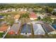 Aerial view of the back of a house showing solar panels, patio set and proximity to neighbors at 2234 Rockwood Dr, Apopka, FL 32703