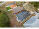 Aerial view of the house with solar panels and a patio set in the backyard at 2234 Rockwood Dr, Apopka, FL 32703