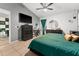 This bedroom includes a TV, a workspace, and a green-themed design, perfect for relaxing or productivity at 2234 Rockwood Dr, Apopka, FL 32703