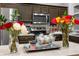 Close up shot of the kitchen showing stainless steel appliances, flowers, and wood cabinets at 2234 Rockwood Dr, Apopka, FL 32703