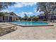 Enjoy the community pool with lounge chairs and shaded seating areas at 2734 Cattail Ct, Longwood, FL 32779