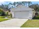 A single-Gathering home with a 2-car garage on a well-maintained lawn under a clear blue sky at 2978 Stillwater Dr, Kissimmee, FL 34743