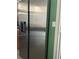 Stainless steel refrigerator in kitchen with adjacent doorway at 2989 Viscount Cir, Kissimmee, FL 34747