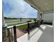 Covered front porch featuring stone-clad columns and black wrought iron railing overlooking a lovely street view at 316 South Zuni Rd, St Cloud, FL 34771